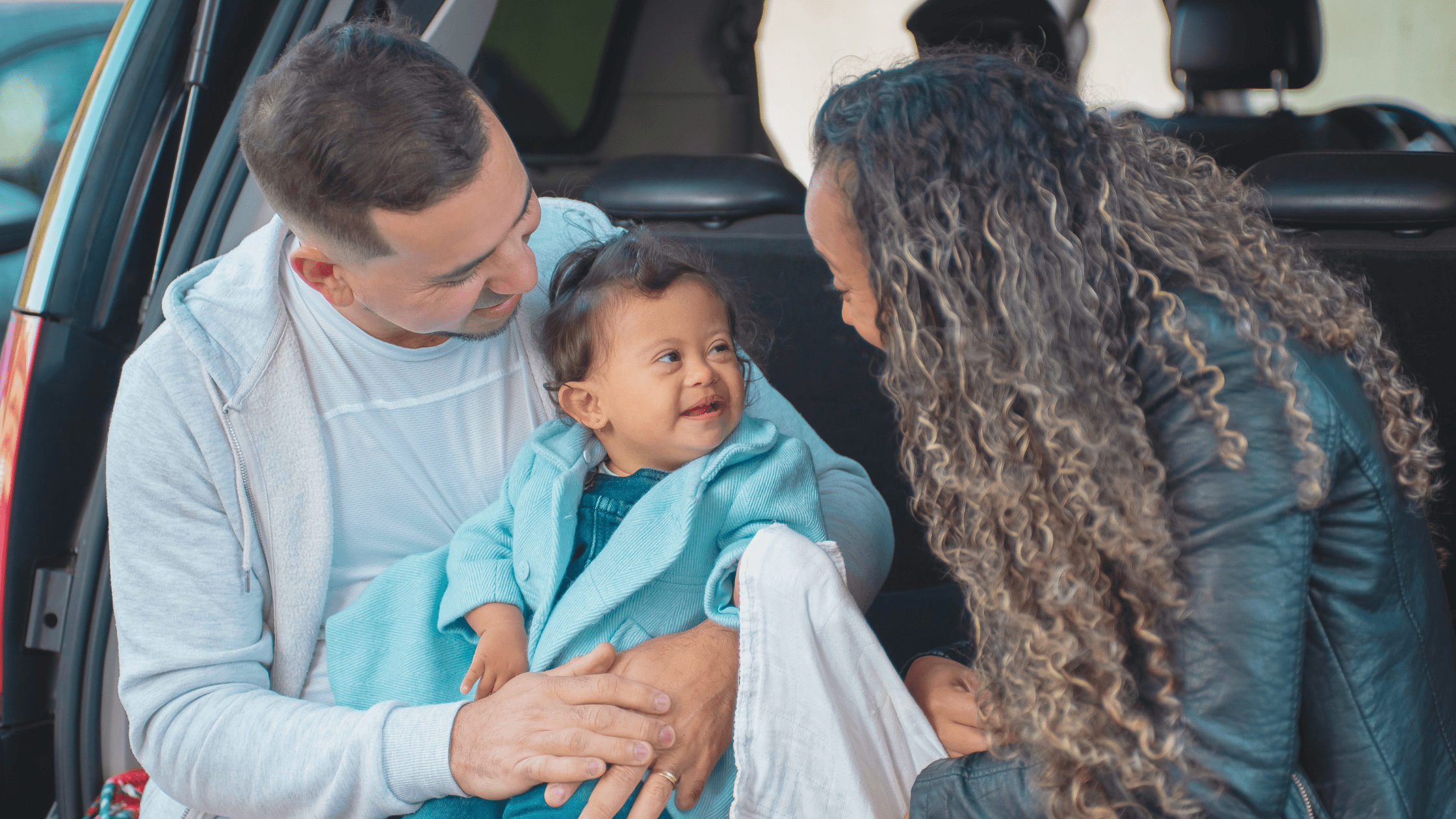Happy family feeding their baby in a car with a bad credit car loan from Sydney Car Loans. Drive away with the car you need, regardless of your credit score